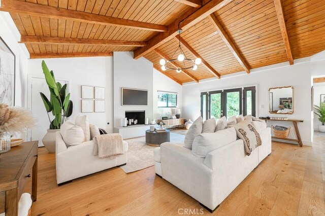6164 Fenwood Ave, Woodland Hills, CA 91367 - living room featuring wooden ceiling with exposed beams, light wood-style flooring, french doors, a chandelier, and high vaulted ceiling