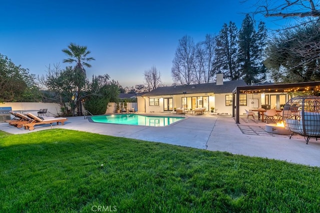 6164 Fenwood Ave, Woodland Hills, CA 91367 - rear view of property featuring a patio area, a chimney, and an outdoor fire pit