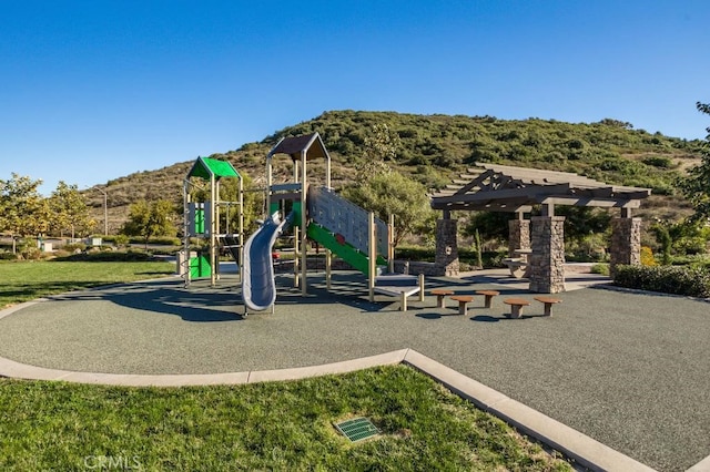 community play area featuring a mountain view