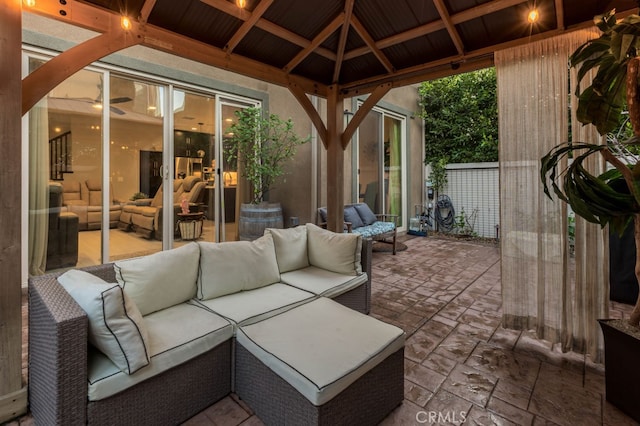 view of patio featuring an outdoor hangout area and a gazebo