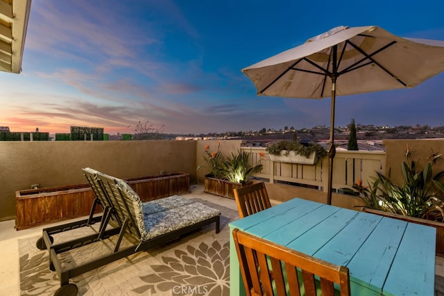 view of patio terrace at dusk