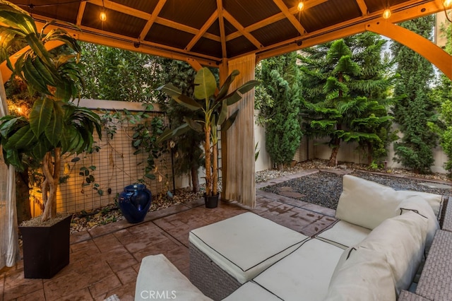 view of patio / terrace with a fenced backyard, a gazebo, and an outdoor hangout area