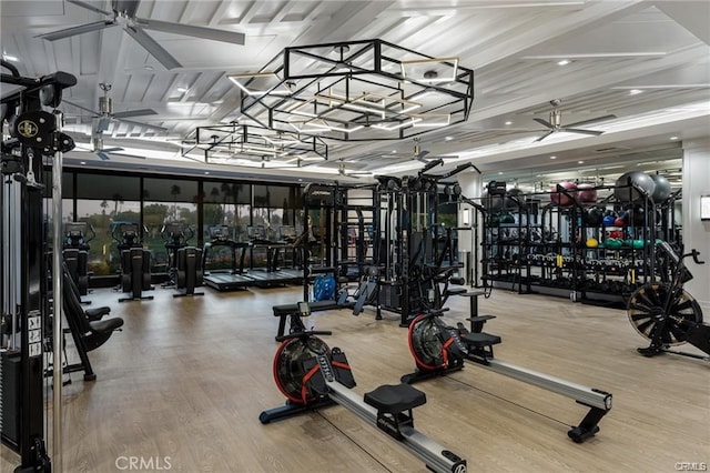 gym with ceiling fan and wood finished floors