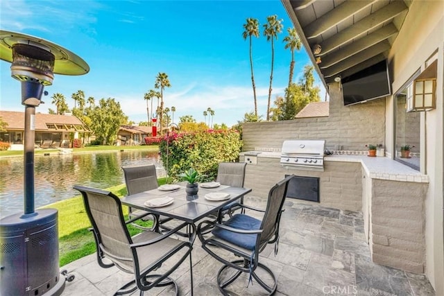 view of patio / terrace with area for grilling, outdoor dining space, and grilling area