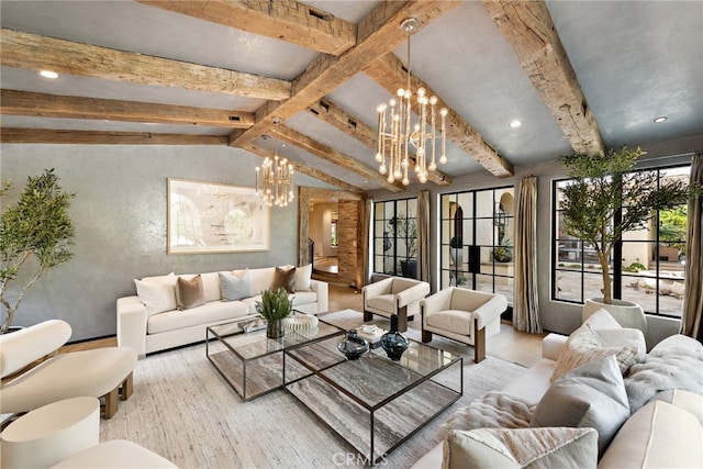 living area with lofted ceiling with beams, a wealth of natural light, and a notable chandelier