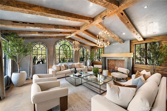 31 Blue Heron, Irvine, CA 92603 - living room featuring a fireplace, an inviting chandelier, recessed lighting, and lofted ceiling with beams