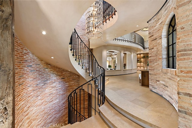 31 Blue Heron, Irvine, CA 92603 - interior space featuring high vaulted ceiling, brick wall, and recessed lighting