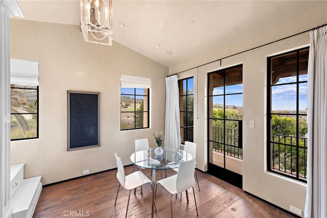 31 Blue Heron, Irvine, CA 92603 - dining space featuring visible vents, a chandelier, hardwood / wood-style flooring, baseboards, and vaulted ceiling