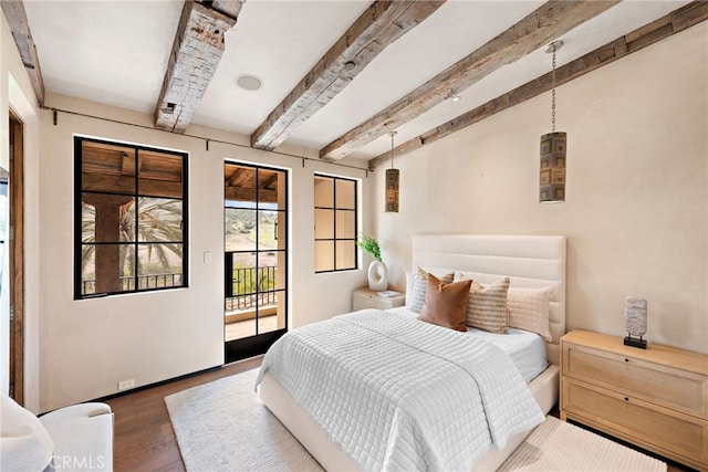 bedroom featuring access to outside, beam ceiling, and wood finished floors