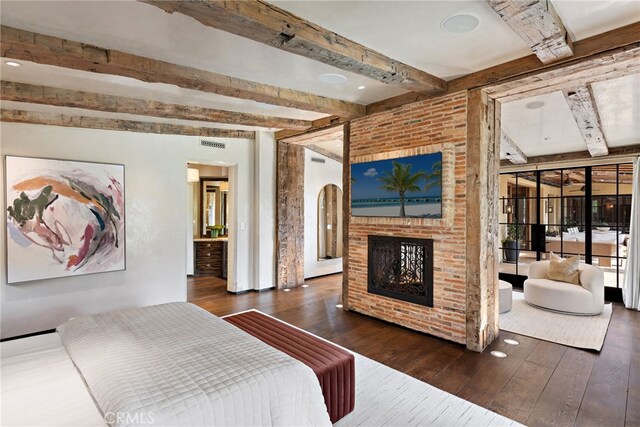 31 Blue Heron, Irvine, CA 92603 - bedroom featuring a fireplace, beam ceiling, and hardwood / wood-style floors