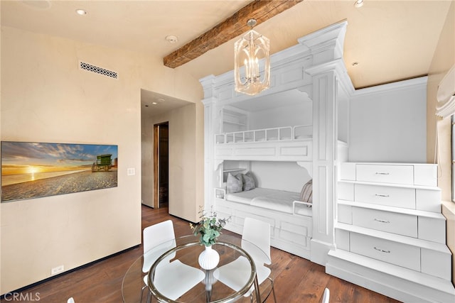 dining area with decorative columns, visible vents, wood finished floors, an inviting chandelier, and beam ceiling