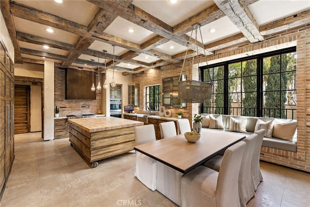 dining space with brick wall, coffered ceiling, and beamed ceiling