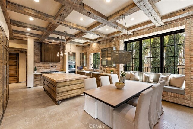 31 Blue Heron, Irvine, CA 92603 - dining room with beam ceiling, a healthy amount of sunlight, coffered ceiling, and brick wall