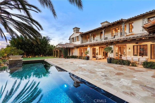 pool with a patio area