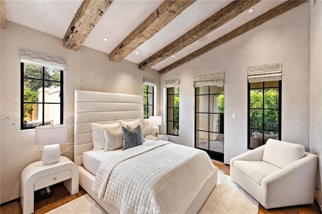 bedroom featuring lofted ceiling with beams, access to outside, multiple windows, and wood finished floors