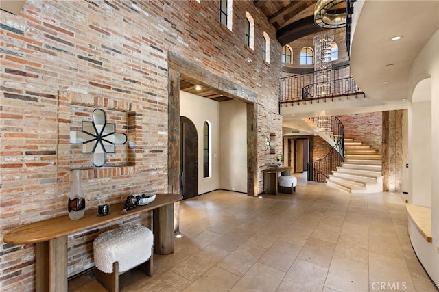 31 Blue Heron, Irvine, CA 92603 - interior space with a towering ceiling, arched walkways, beamed ceiling, and stairs