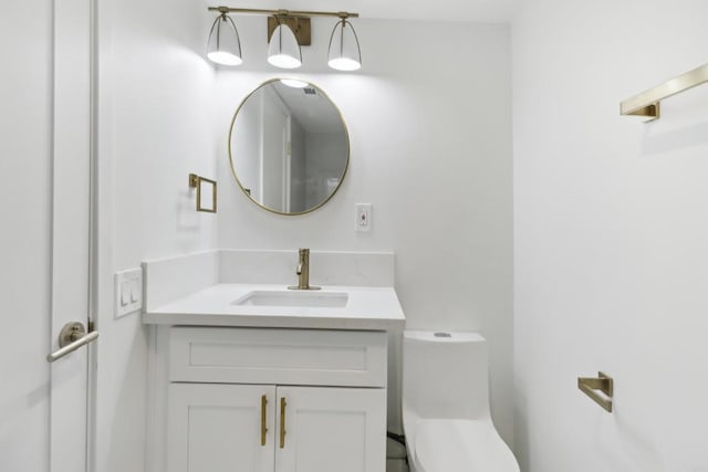 bathroom with vanity and toilet