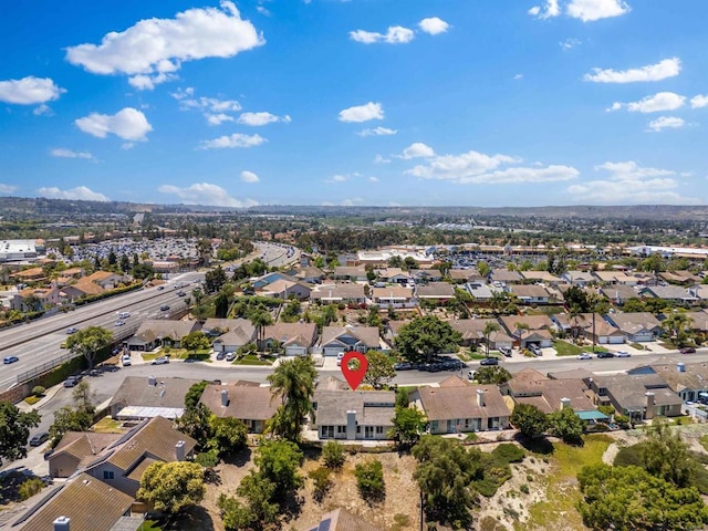 birds eye view of property with a residential view