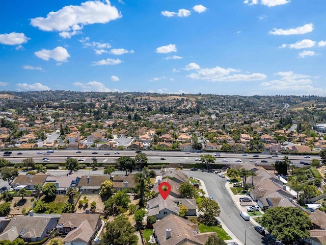 birds eye view of property with a residential view