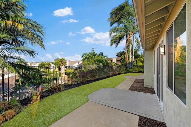 view of yard with a patio area and a fenced backyard