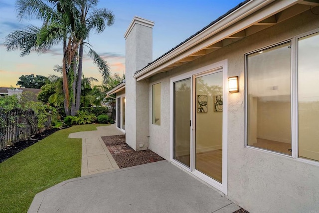 exterior space with a lawn and fence