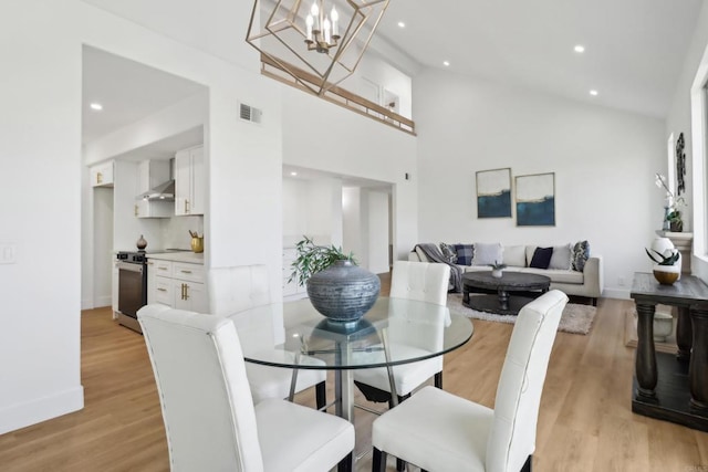 dining room with light wood-style floors, recessed lighting, a chandelier, and visible vents