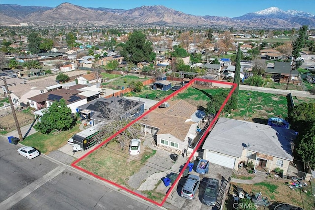 birds eye view of property with a residential view and a mountain view