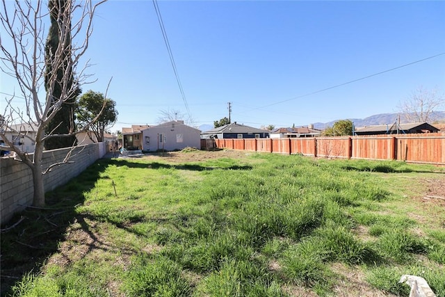 view of yard with a fenced backyard