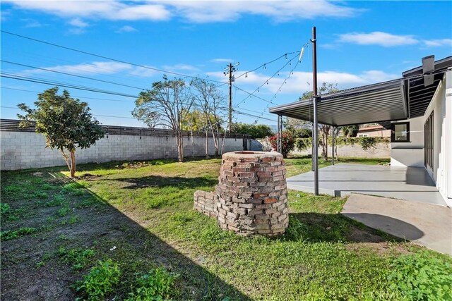 view of yard featuring a fenced backyard and a patio