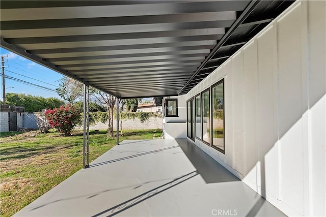 view of patio featuring fence