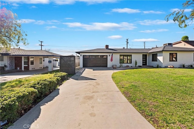 ranch-style home with driveway, an attached garage, and a front yard