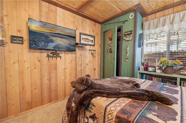 carpeted bedroom with vaulted ceiling, wood ceiling, and wood walls