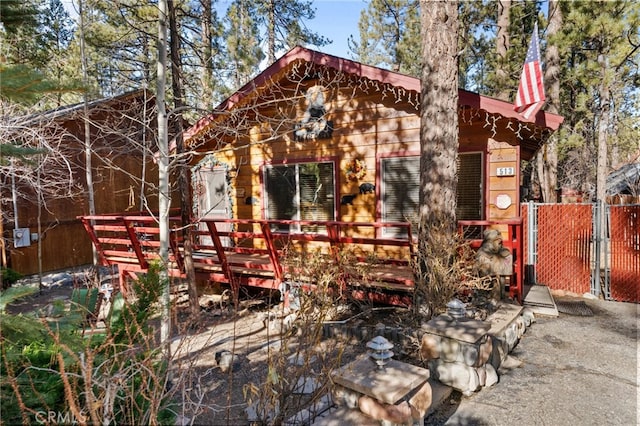 view of front of home featuring fence