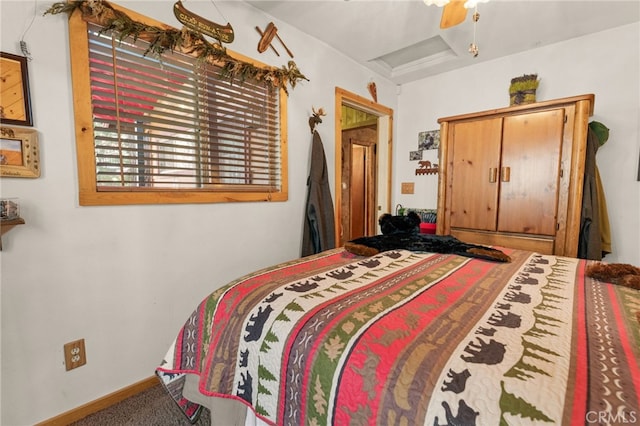 bedroom featuring carpet floors, attic access, baseboards, and ceiling fan