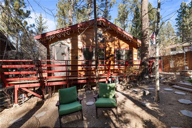 exterior space with fence and a wooden deck