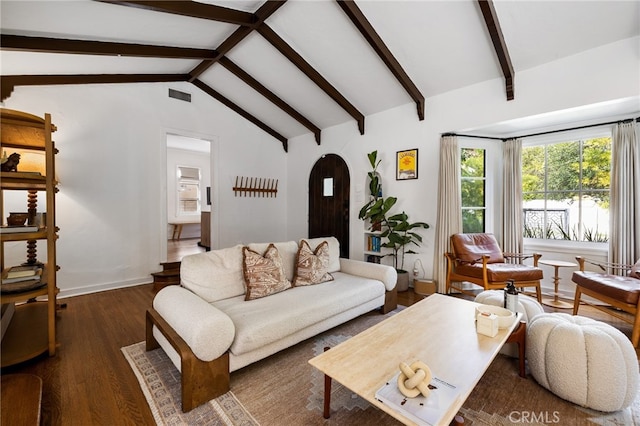 living area featuring vaulted ceiling with beams, dark wood-style flooring, visible vents, and baseboards