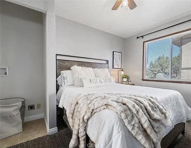 bedroom with ceiling fan, carpet floors, and baseboards