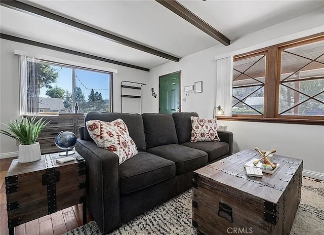 2161 4th Ln, Big Bear City, CA 92314 - living room featuring beamed ceiling, plenty of natural light, and baseboards
