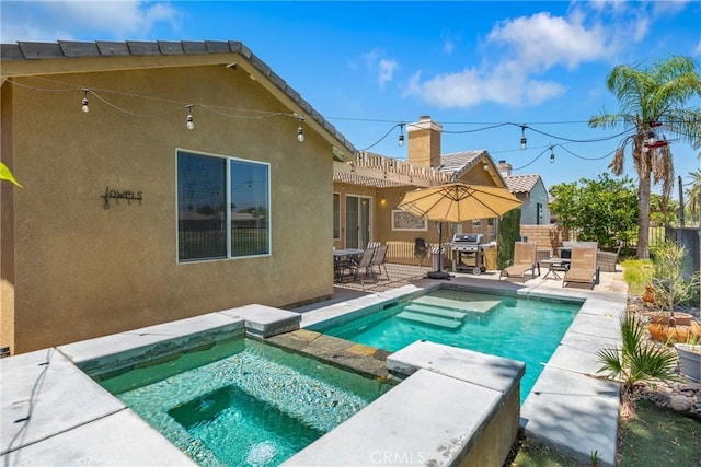 view of swimming pool featuring a fenced in pool, grilling area, a patio area, fence, and an in ground hot tub