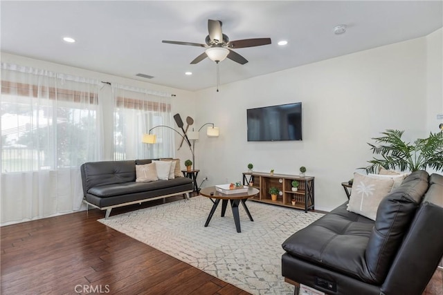 living room with ceiling fan, wood finished floors, visible vents, and recessed lighting