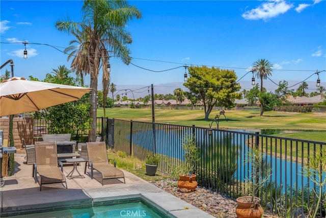 view of swimming pool featuring a fenced in pool, a fenced backyard, and a patio