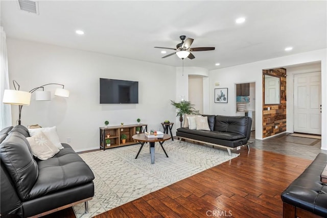 living area with visible vents, dark wood finished floors, baseboards, ceiling fan, and recessed lighting