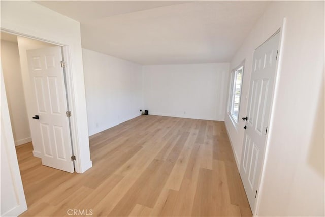 spare room featuring light wood finished floors