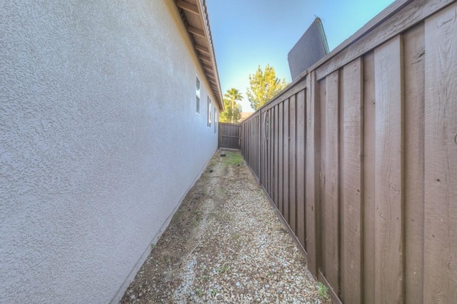 view of home's exterior featuring fence and stucco siding