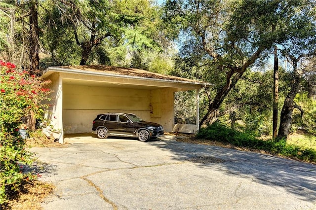 view of car parking featuring a carport and driveway