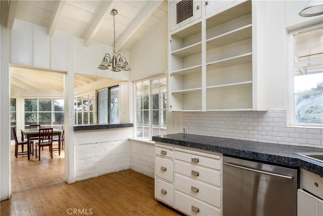 kitchen with dark countertops, open shelves, and dishwasher