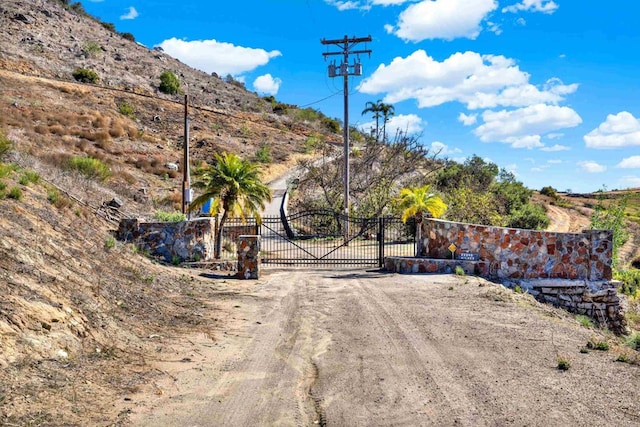 29345 Wilkes Rd, Valley Center, CA 92082 - view of dirt / gravel road featuring a gate
