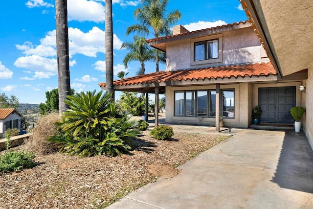 29345 Wilkes Rd, Valley Center, CA 92082 - back of house featuring stucco siding and a tile roof