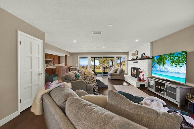 29345 Wilkes Rd, Valley Center, CA 92082 - living area featuring dark wood-style floors, a fireplace, and recessed lighting