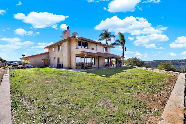 29345 Wilkes Rd, Valley Center, CA 92082 - back of property featuring a chimney, a patio, stucco siding, and a lawn